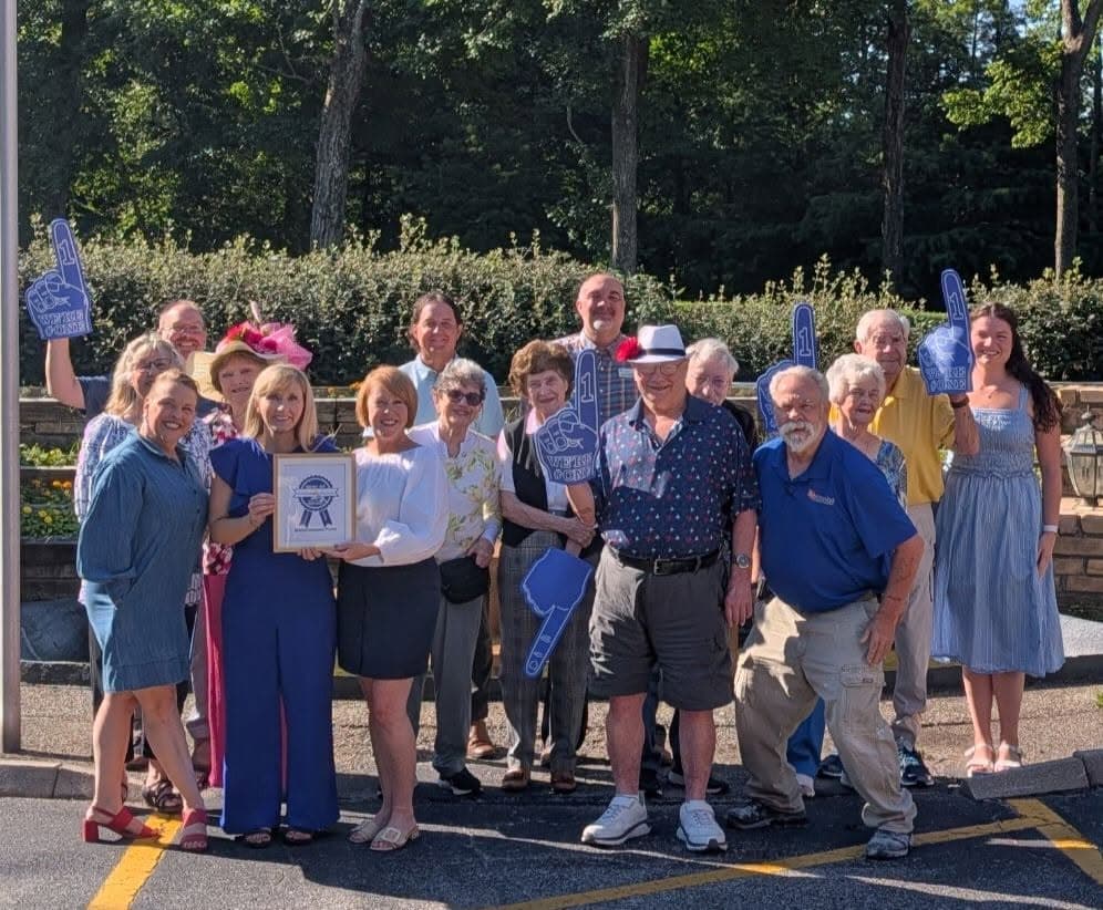 Staff and residents celebrating Best of Kentuckiana award outdoors